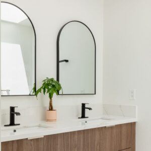 a double vanity with two mirrors
