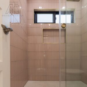 a pink tiled shower